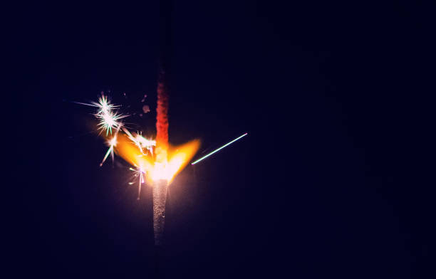 istock Sparks in the dark. Sparks. Christmas and New Year time. Magic light 1220832785