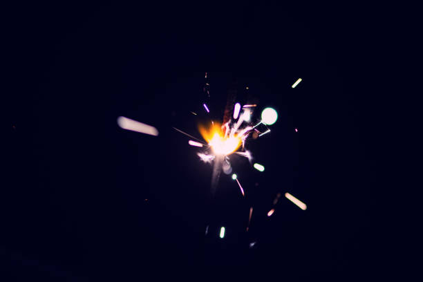 istock Sparks in the dark. Sparks. Christmas and New Year time. Magic light 1220832788