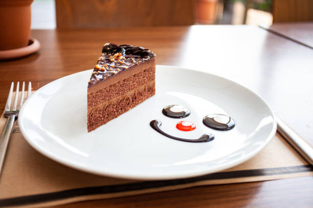 istock chocolate cake in the white plate is on the wood table 1220832992