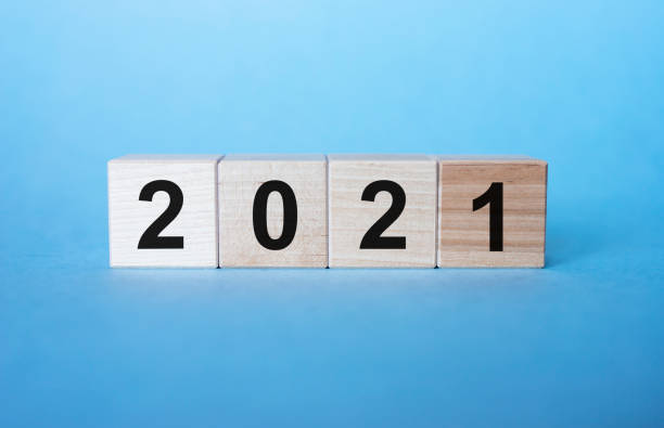 istock 2021 new year on wooden cubes on light blue background 1220833245