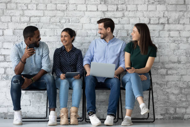 istock Happy multiracial candidates have fun waiting for interview 1220833381