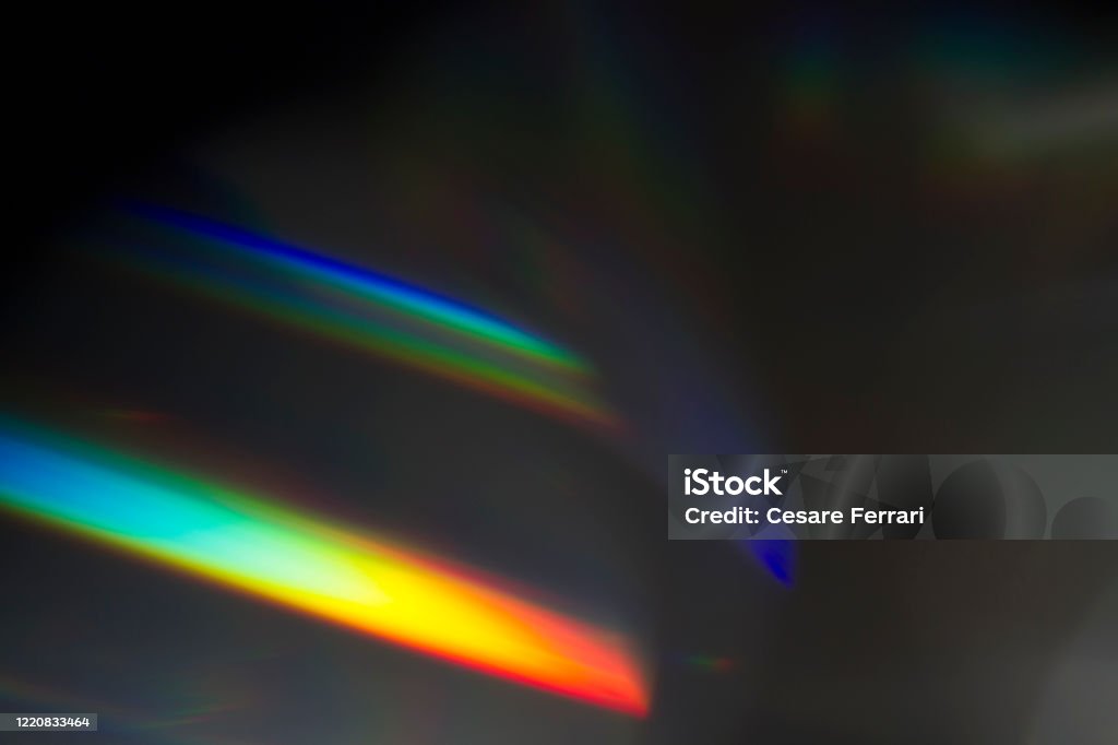 Light leak on black background Sun reflection over a piece of crystal for a colorful lens flare on black background Light Leak Stock Photo