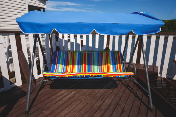 istock Large soft swing with a sun awning on the Terrace. River View. 1220834818