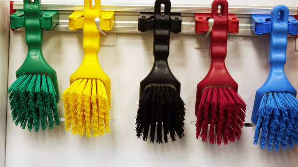 Multi-colored brushes for cleaning the house. Set of cleaning products stock photo
