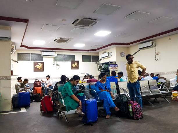 April 15. Howrah Station, West Bengal, India. Travelers stranded and crowding at Howrah station waiting room as trains get canceled due to covid19. April 15. Howrah Station, West Bengal, India. Travelers stranded and crowding at Howrah station waiting room as trains get canceled due to covid19. kolkata night stock pictures, royalty-free photos & images