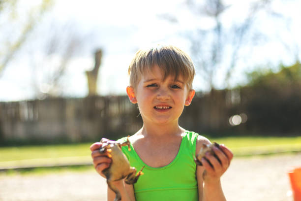 The child goes in for sports at the stadium. The boy training before playing football. High quality photo