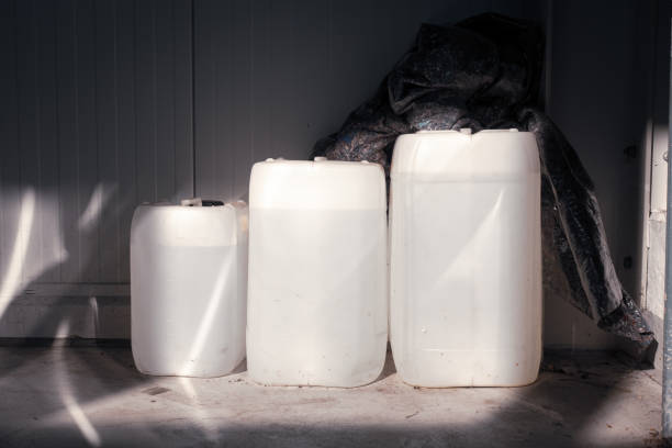 istock three filled white canisters of different sizes standing on a wall in a workshop 1220839878