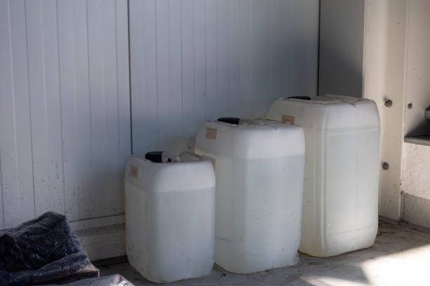 istock three filled white canisters of different sizes standing on a wall in a workshop 1220839879