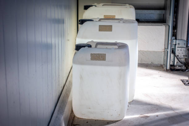istock three filled white canisters of different sizes standing on a wall in a workshop 1220839893