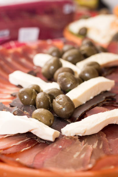 istock Cured meat with cheese and olives on the plate 1220840602