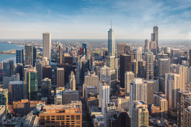 urban chicago cityscape golden hour aerial view - chicago aerial photos et images de collection