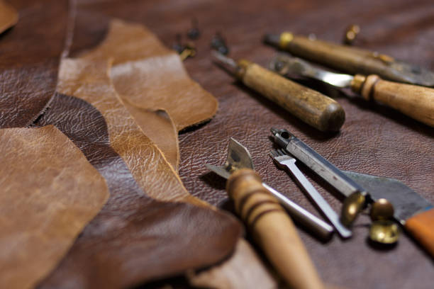 istock Crafting tools on natural cow leather in the tailoring workshop. 1220840831