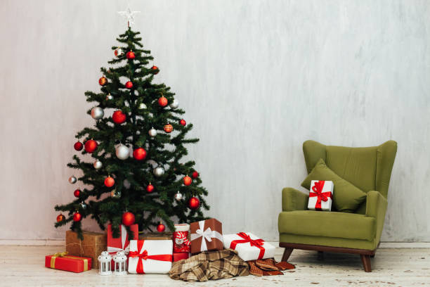 istock Christmas tree with gifts decor new year winter background 1220842086