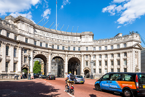 London, United Kingdom – May 27, 2023: A collection of British flags flying proudly outside the Admiralty Arch in London