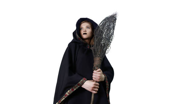 istock A girl in a black robe, making magic movements. 1220845201