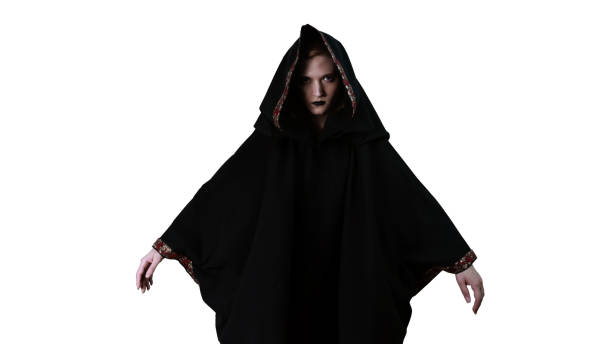 istock A girl in a black robe, making magic movements. 1220845218