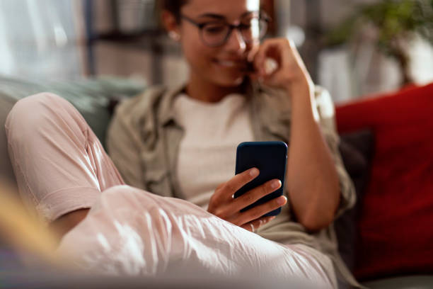 istock Receiving his texts always brings a smile to her face 1220845938