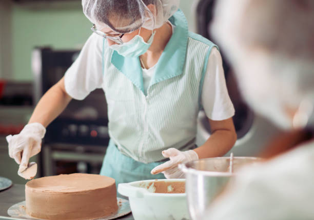 istock Caterer preparing food in commercial kitchen 1220847781