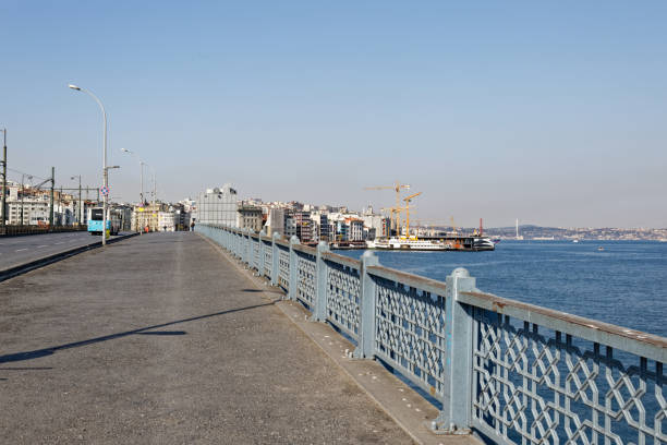 Empty Galata Bridge during Coronavirus Restrictions Empty Galata Bridge during Coronavirus pandemic restrictions and lockdown measures which is normally full of road fishers. galata photos stock pictures, royalty-free photos & images