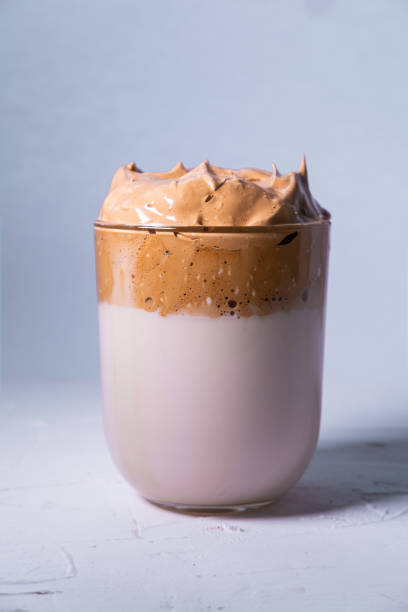istock Dalgona coffee isolated on white background. Korean iced coffee. Close up view. Vertical picture. 1220856935