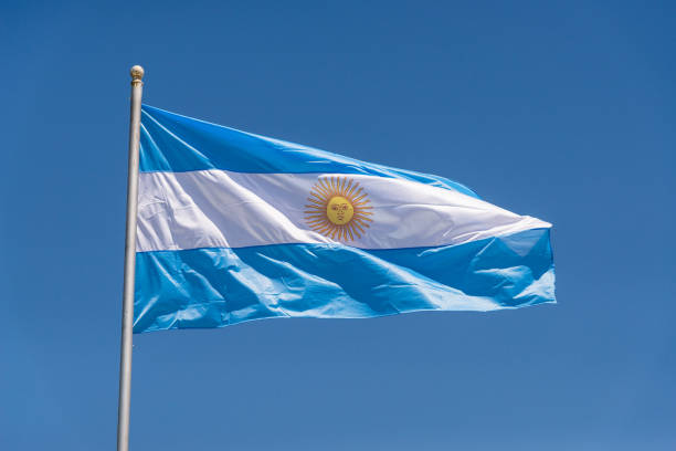 istock Argentinian flag waving against blue sky on a sunny day 1220857655