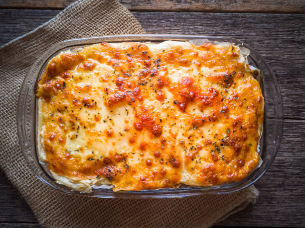 istock Meat hideout with cassava and melted cheese. Rustic wood background. 1220857793
