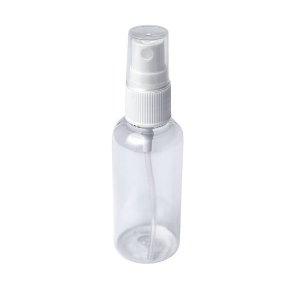 istock Instant antiseptic hand sanitizer mist spray, antibacterial alcohol liquid. One transparent plastic bottle with atomizer pump isolated on white background, studio shot. 1220857824
