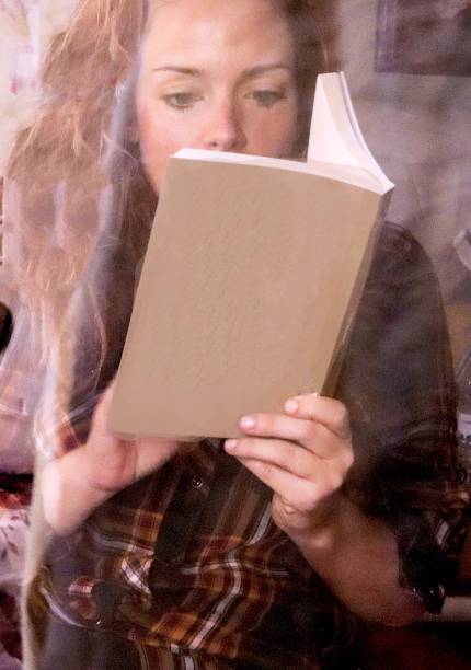 istock girl with book reading book 1220862943