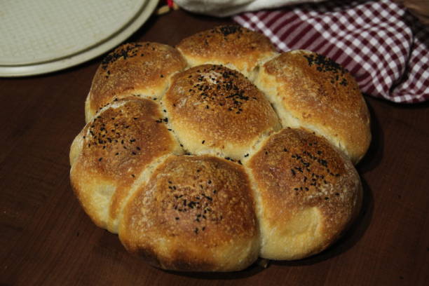 istock Cooking organic bread at home due to quarantine. Breads in slices while baking in the oven and after cooking 1220862964