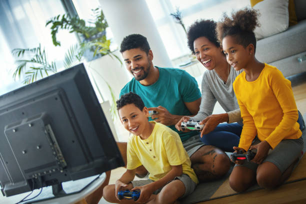 istock Family playing video games at home. 1220865630