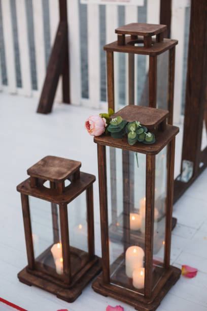 istock Wooden candlesticks with burning candles 1220866293