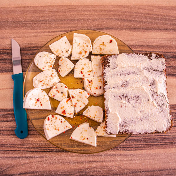 istock Top view of breakfast plate with white flavored cheese and bred 1220866318