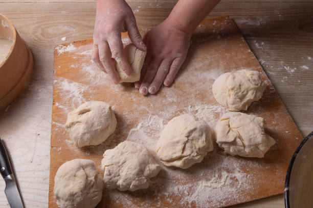 istock Female hands mixing dough in the home kitchen. 1220868455