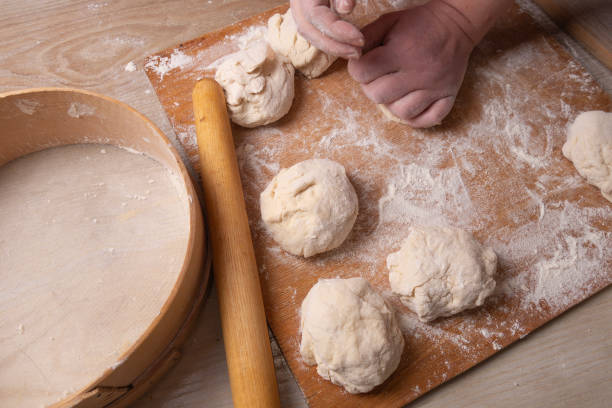 istock Female hands mixing dough in the home kitchen. 1220868469