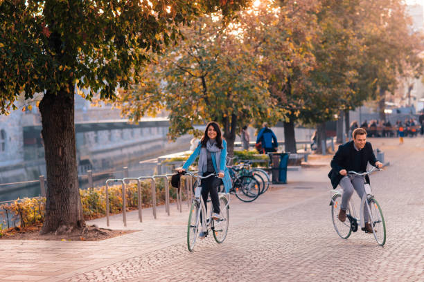 istock Couple Riding Bicycles In Autumn 1220868600