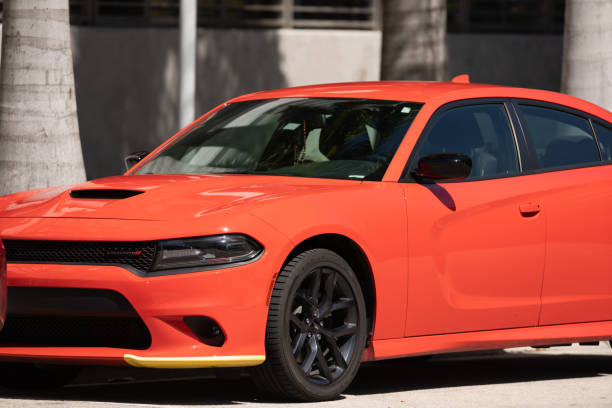 Orange Dodge Charger closeup front drivers quarter Miami, FL, USA - April 22, 2020: Orange Dodge Charger closeup front drivers quarter dodge charger stock pictures, royalty-free photos & images