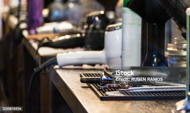 Hairdresser Tools On A Desk No People Barber Shop Closed During Pandemic Lockdown Stock Photo - Download Image Now