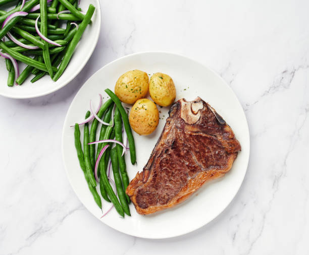 istock Dry Aged Beef Steak with potatoes and green beans 1220882969