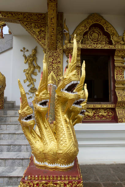 istock A beautiful ancient golden Naga statue in a Thai temple 1220885066