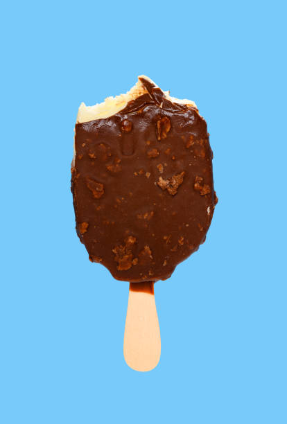 istock chocolate outer popsicle with couple of bites on blue background 1220886836