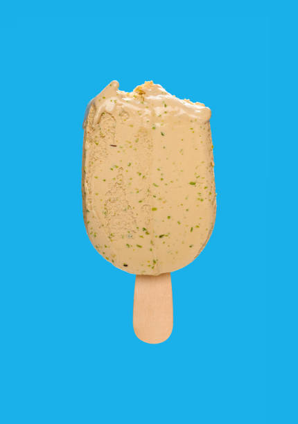 istock matcha popsicle with couple of bites on a blue background 1220886887