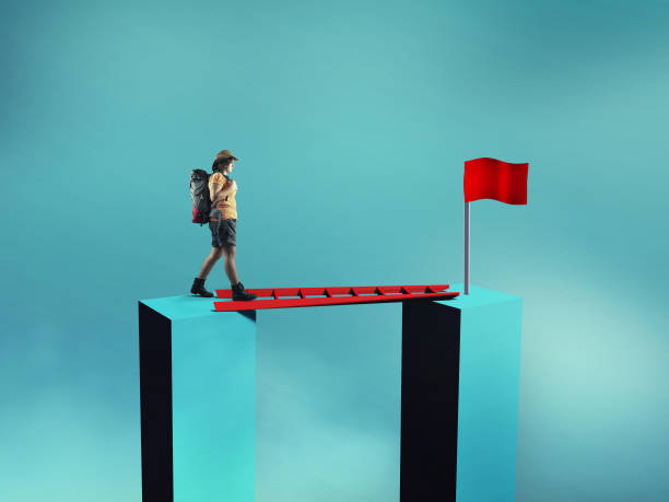 istock Traveler walk on a ladder between two cubes . Path to success . Overcoming obstacles concept . 1220890040