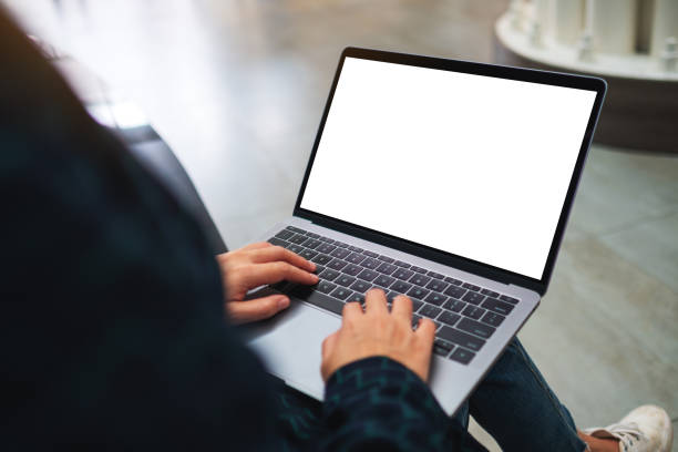 istock a woman using and typing on laptop computer with blank white desktop screen 1220890147