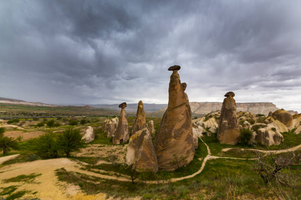 istock Beautiful sandstone rock formations in Cappadocia, Goreme, Turkey, under dramatic stormy sky 1220899794