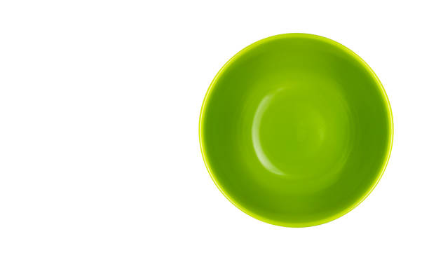 A ceramic bowl dishware isolated on white background without shadow with copy space. Top view of Empty Green bowl in close-up