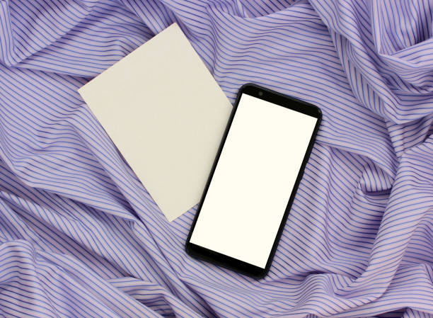 istock smartphone with a white screen and an empty cardboard card 1220902467