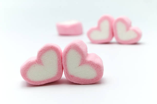istock Pink sweet heart shape marshmallow isolated on white background. 1220904069