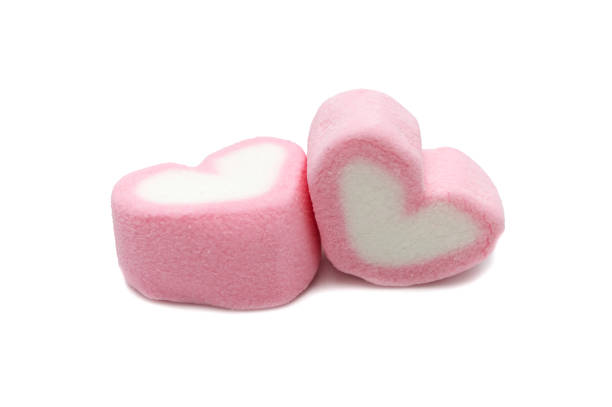 istock Pink sweet heart shape marshmallow isolated on white background. 1220904079