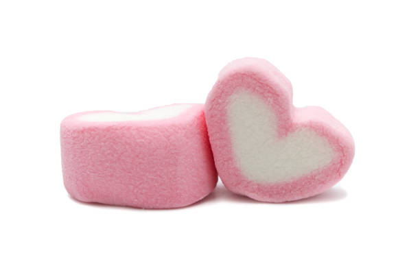 istock Pink sweet heart shape marshmallow isolated on white background. 1220904080