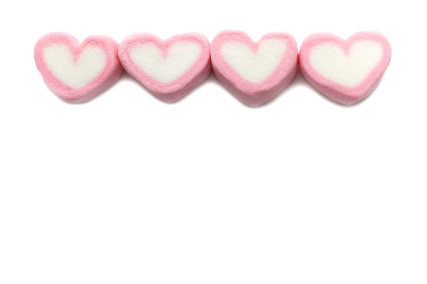 istock Pink sweet heart shape marshmallow isolated on white background. 1220904082